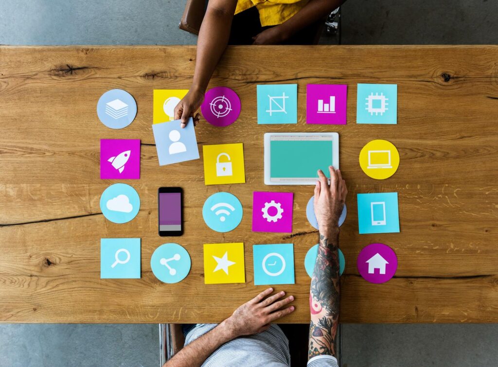 Group Of Computer Icon On The Wooden Table P77YUSB 1024x755